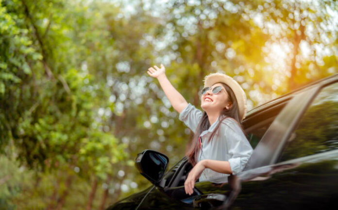 Enjoy Car travel of woman driving with sunglasses journey at nature forest in summer vacation road trip on holidays to destination, Traveler transportation vehicle people lifestyle